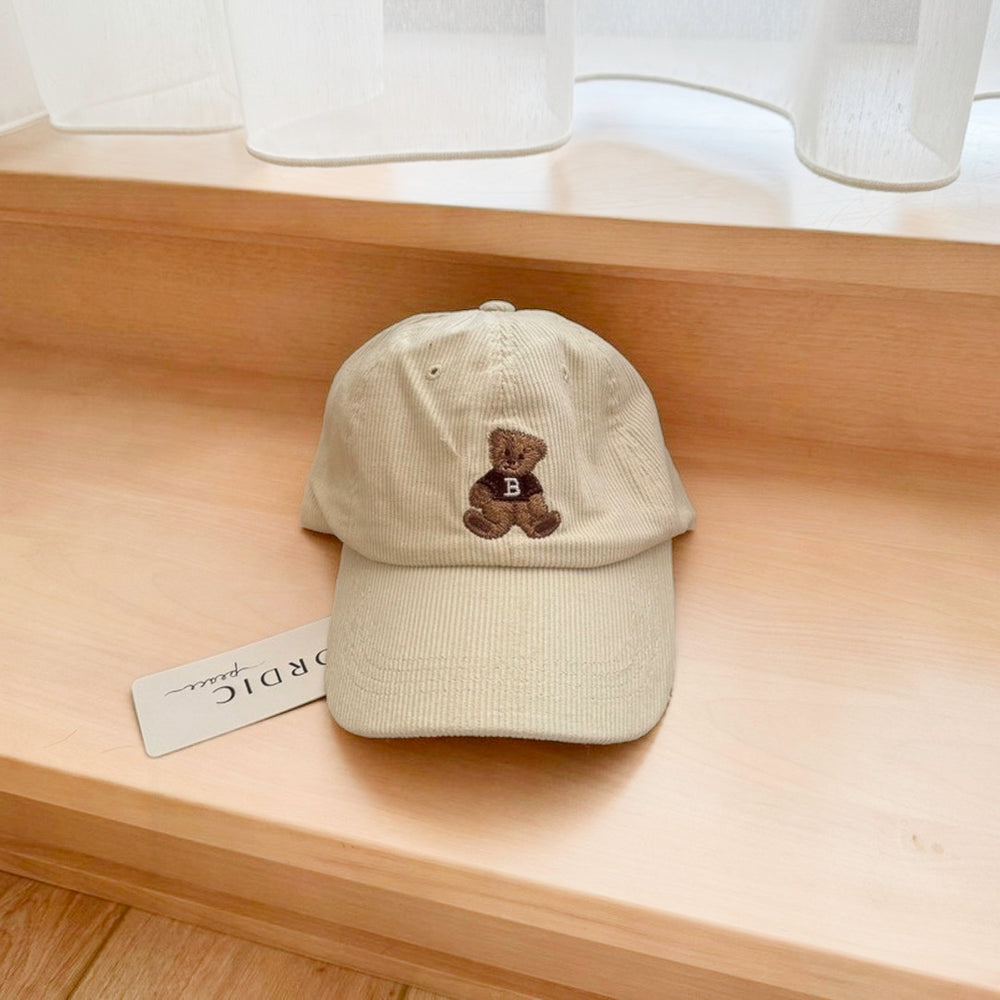 Beige corduroy cap with teddy bear embroidery