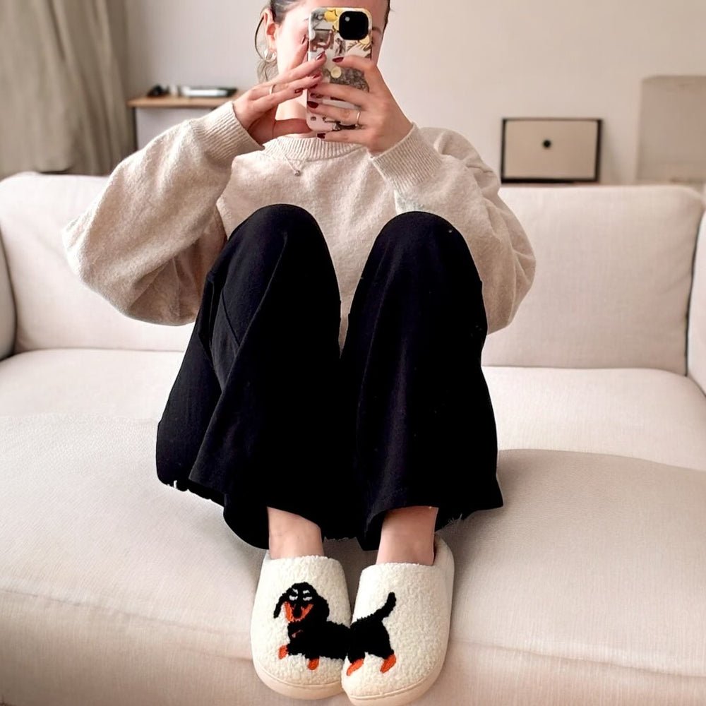 Woman on couch wearing Dachshund slippers - Photoroom_20250122_120625