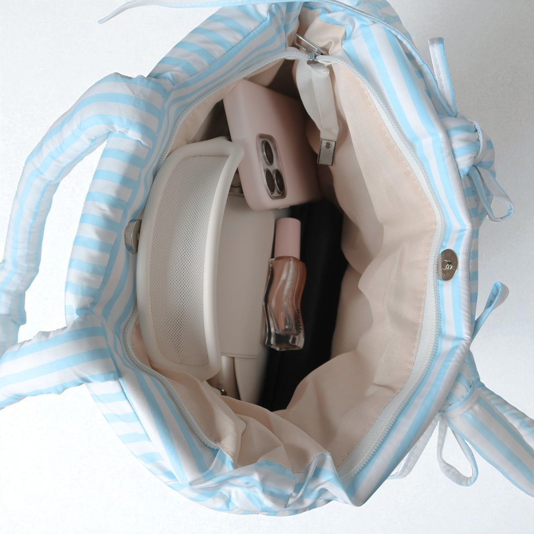 magnetic closure striped puffer bag for women’s outfits