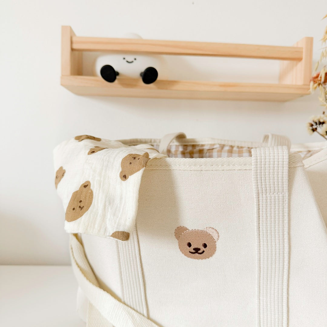 Stylish diaper bag with gingham lining and drawstring top