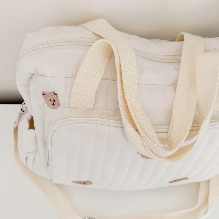 Baby changing tote bag in cream quilted fabric