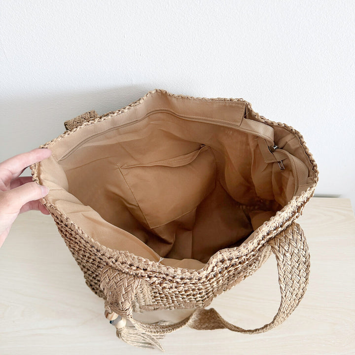 Woven beach tote bag with braided shoulder straps