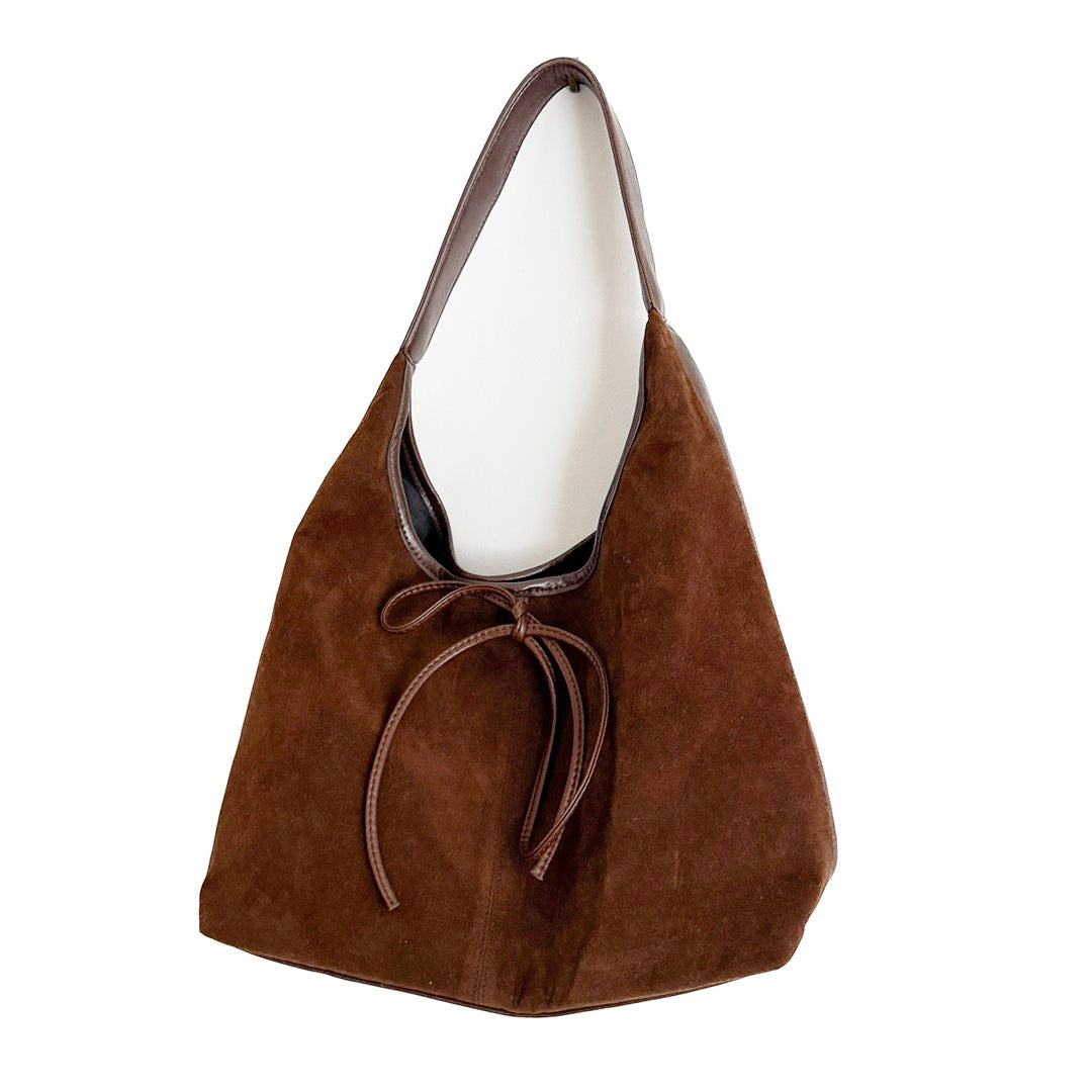 Stylish bow handbag with soft suede finish and wide opening