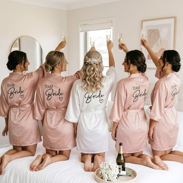 Blush satin bridesmaid robes with white bridal robe