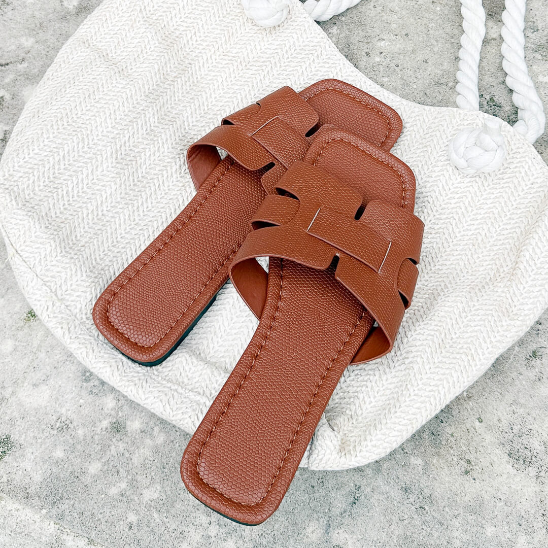 Minimalist flat sandals with cross strap detail