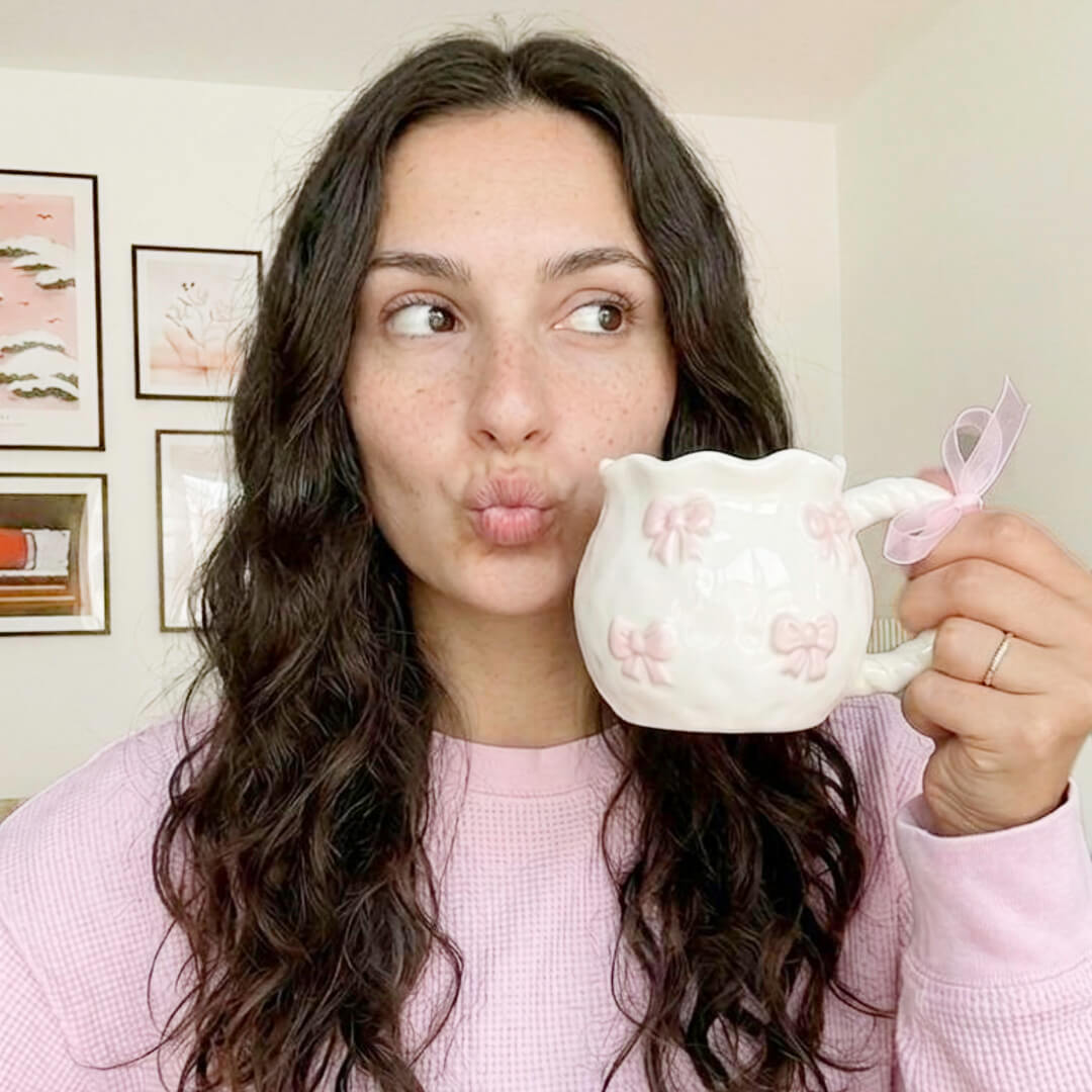 Ceramic coffee mug with raised pink bows