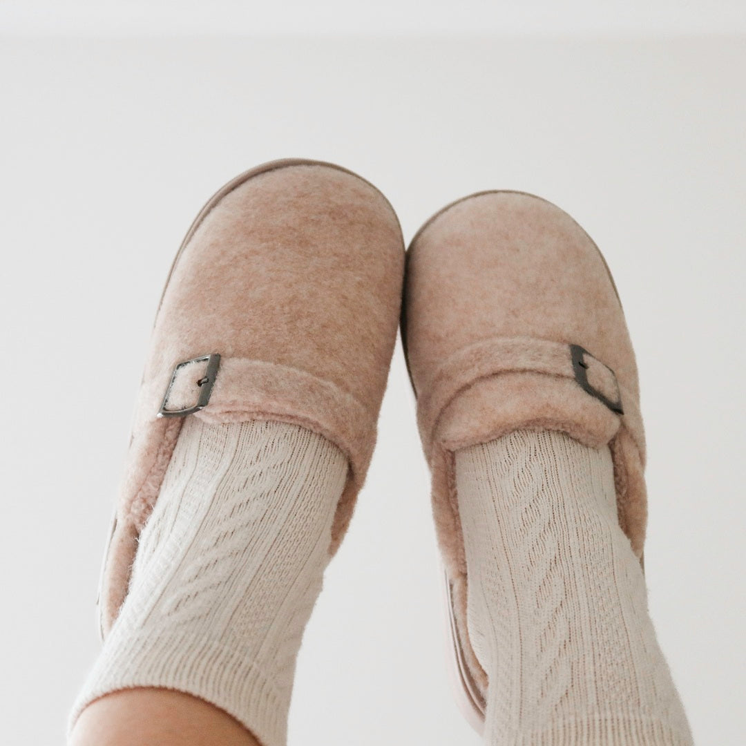 Plush slippers for women featuring a soft fuzzy texture