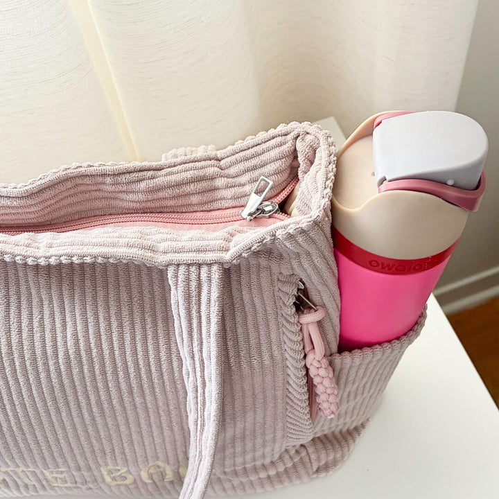 Neutral tote bag with side pockets and top zipper