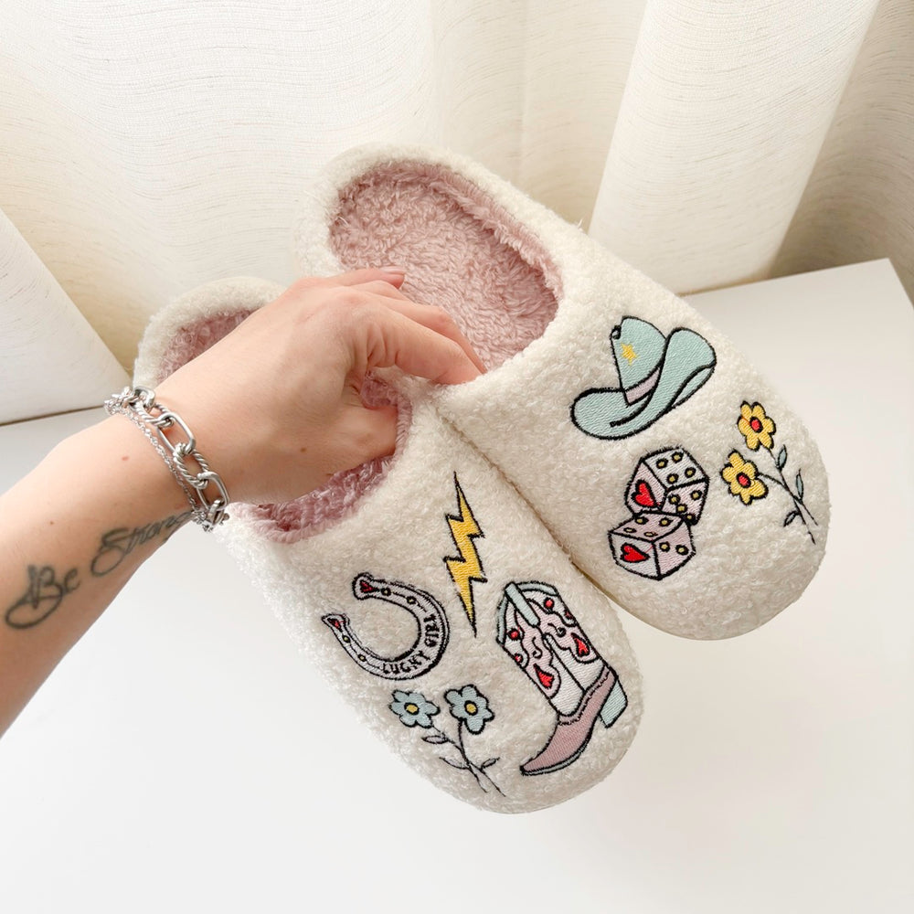 Soft plush house slippers with cowgirl icons and cozy lining