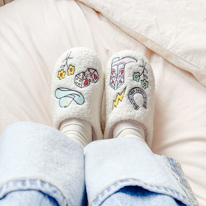 Comfortable house slippers with plush texture and western icons