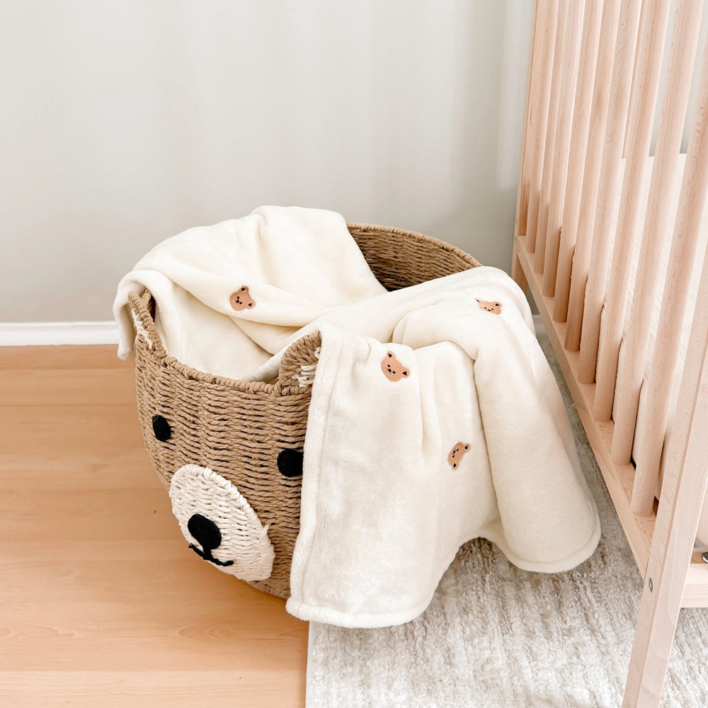 Soft cream baby blanket with embroidered bear accents