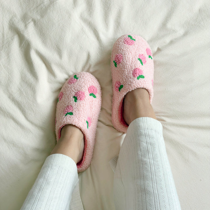 Pink fuzzy slippers with warm plush interior