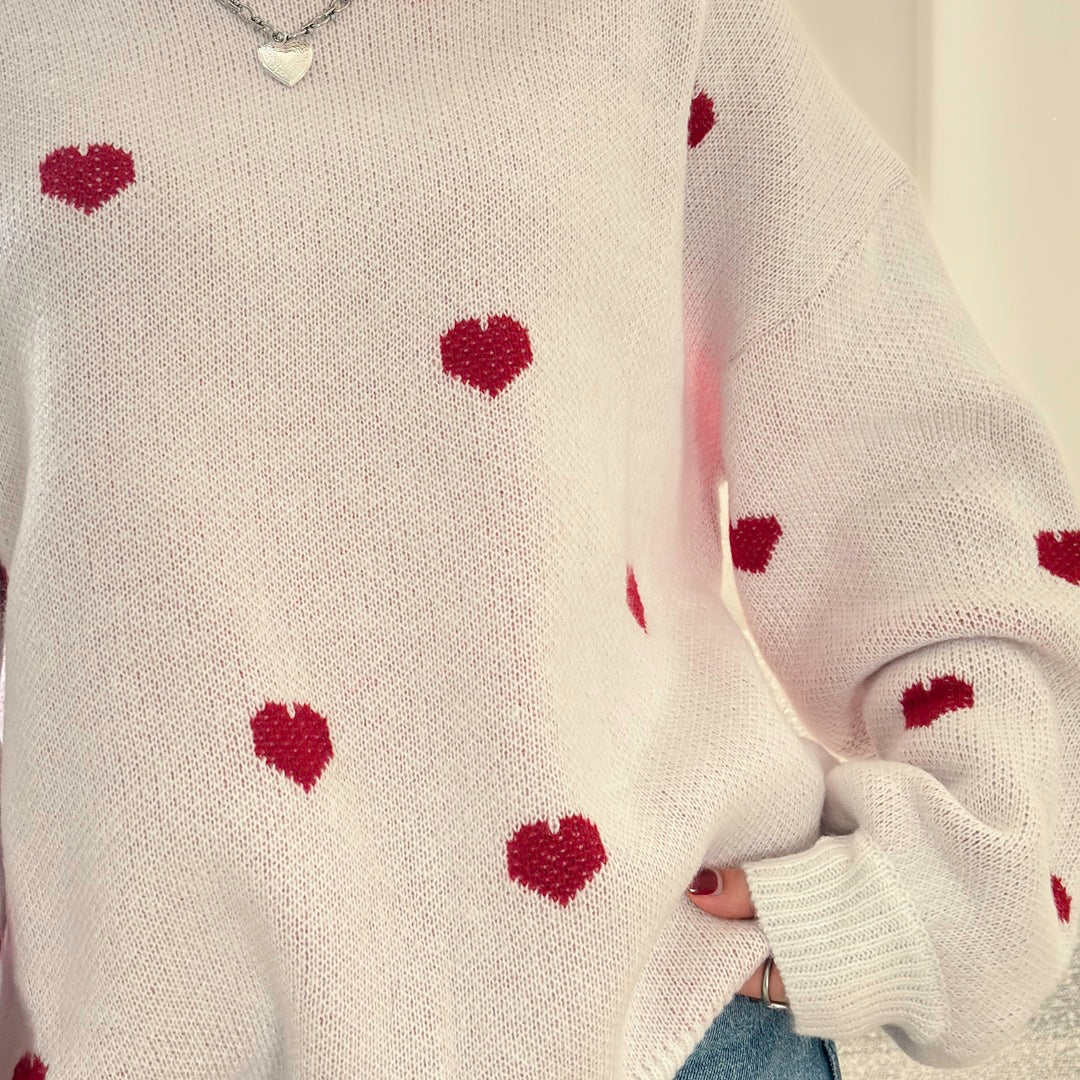 Women’s knit sweater with scattered heart design