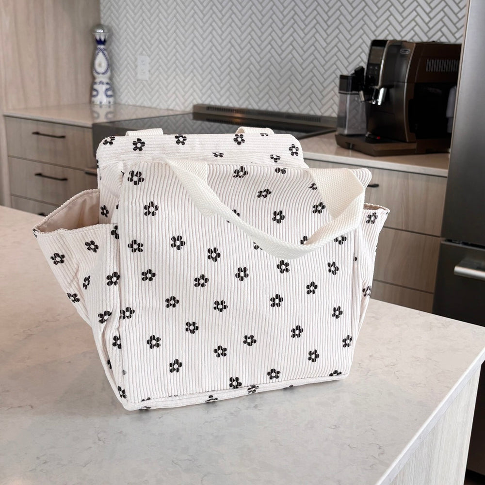 White tote bag with black flower pattern