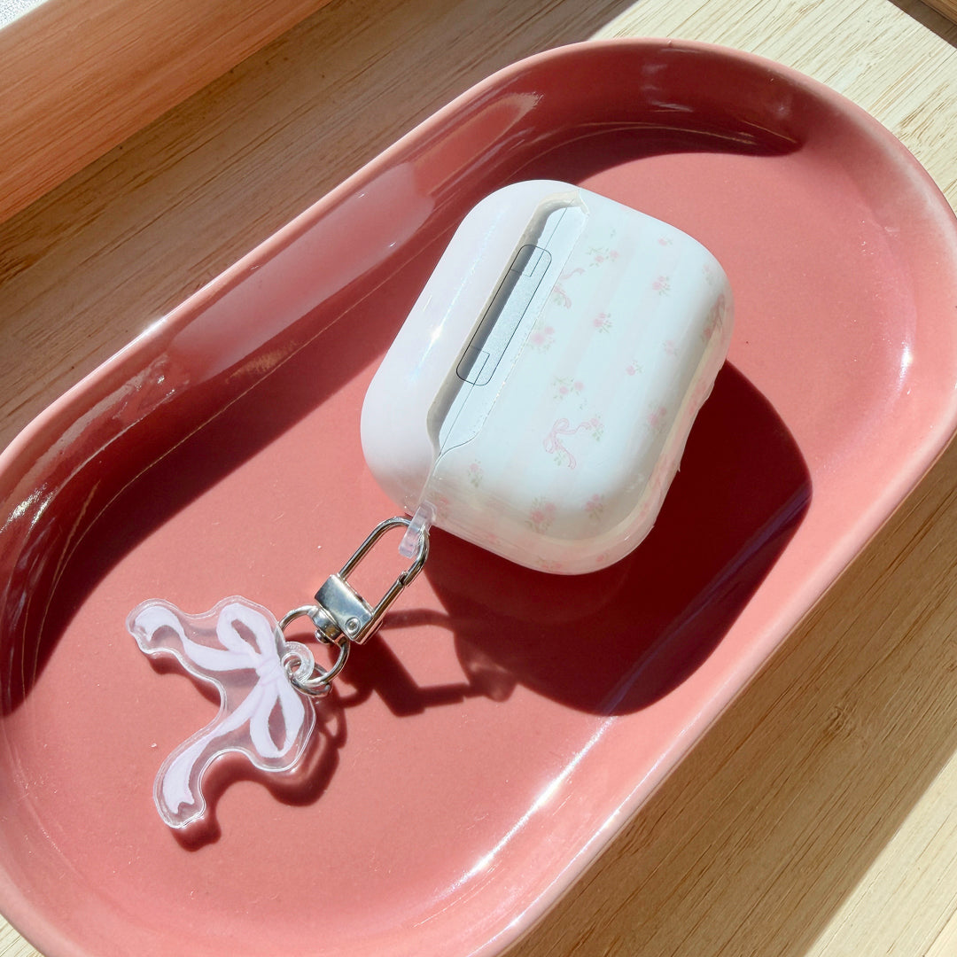 Floral AirPods case with matching bow charm and metal keyring