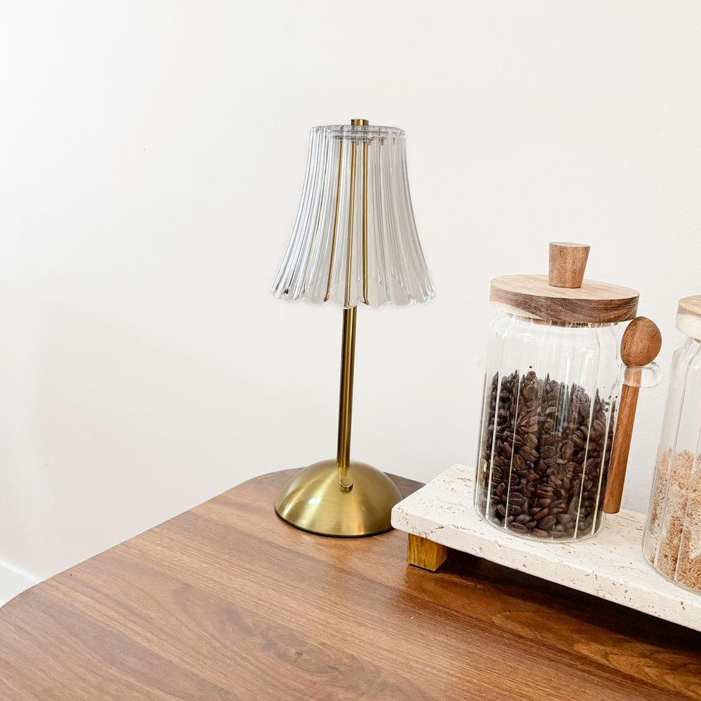 Contemporary table lamp with fluted glass shade