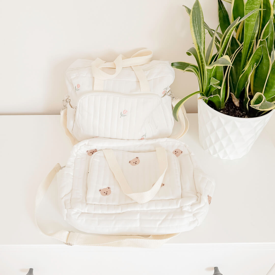 Quilted cream diaper tote bag with shoulder strap