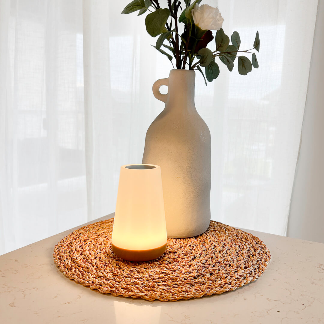 Minimal table lamp with warm glowing shade
