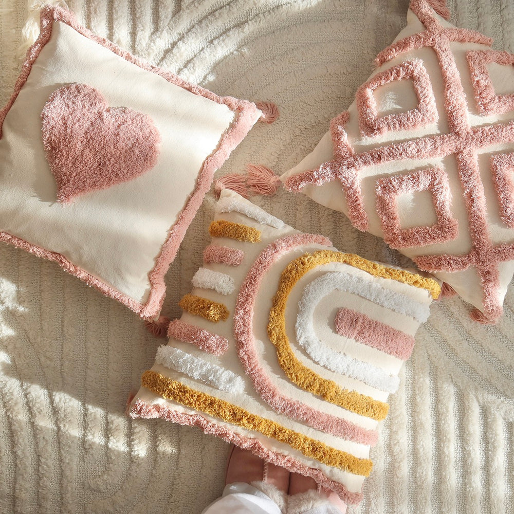Dreamy tufted pillow covers with heart, geometric, and rainbow designs