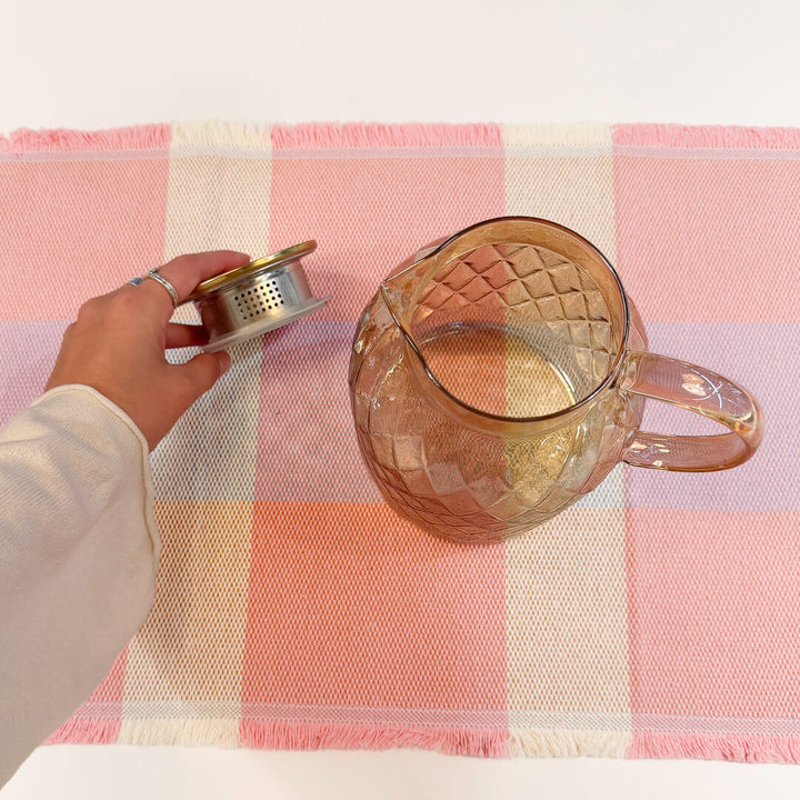 Vintage-inspired glass water pitcher with warm golden brown finish