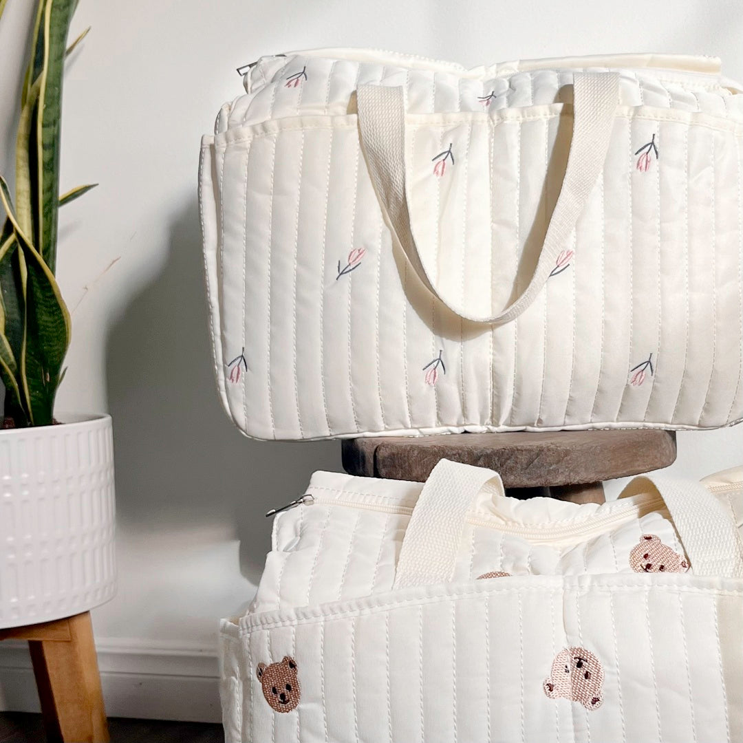 Quilted diaper bag with bear embroidery and side pockets