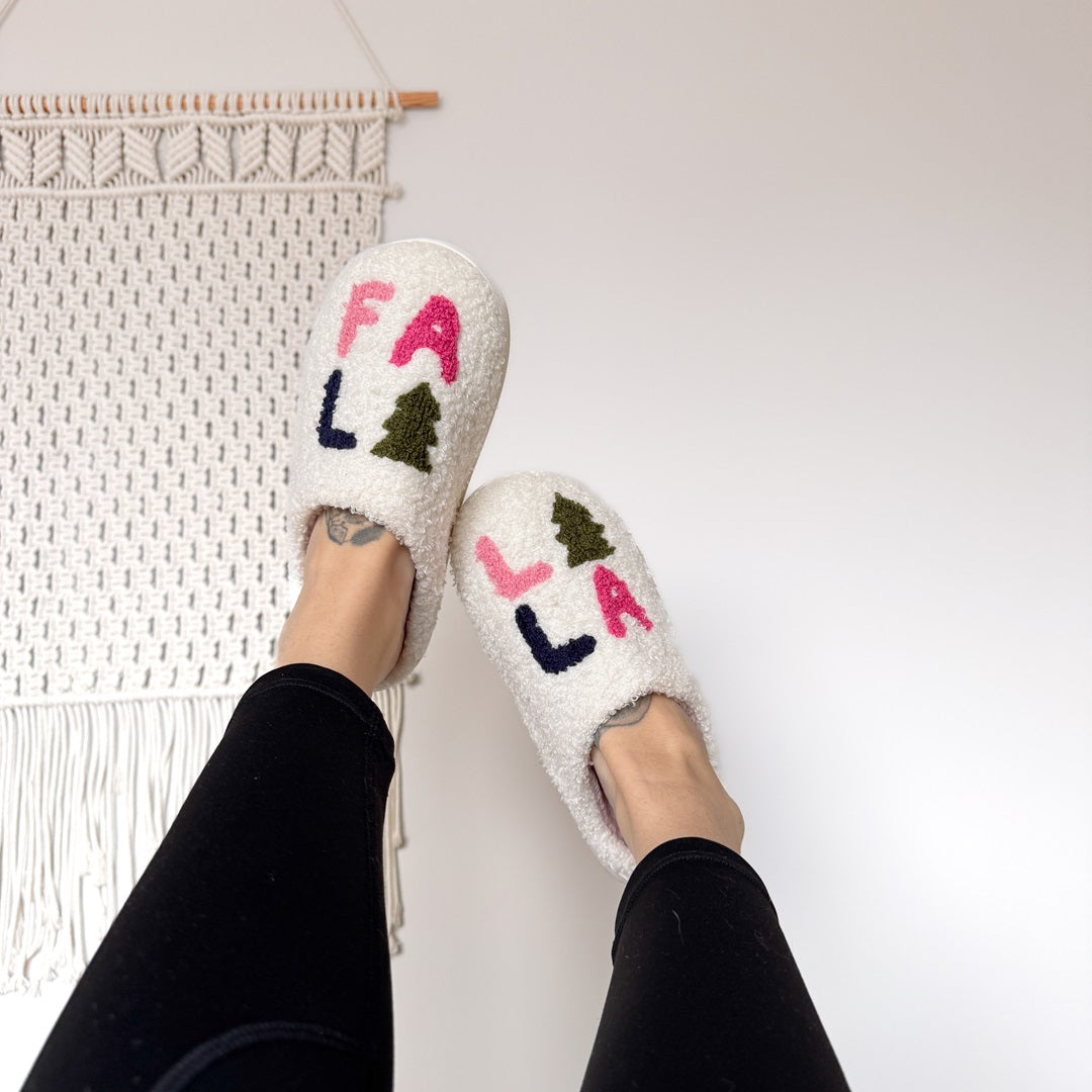 Cozy holiday slippers with Fa La La lettering and Christmas tree design