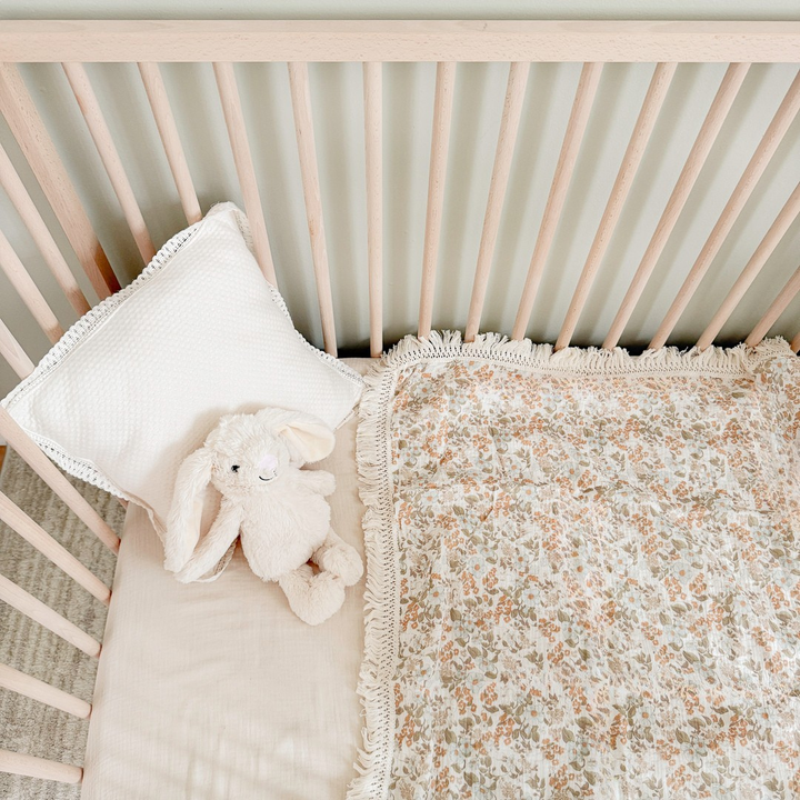 Floral baby blanket with soft fringe trim