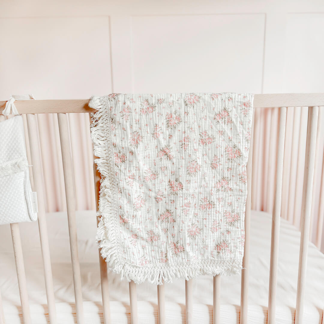 Floral baby blanket with delicate pink flower print