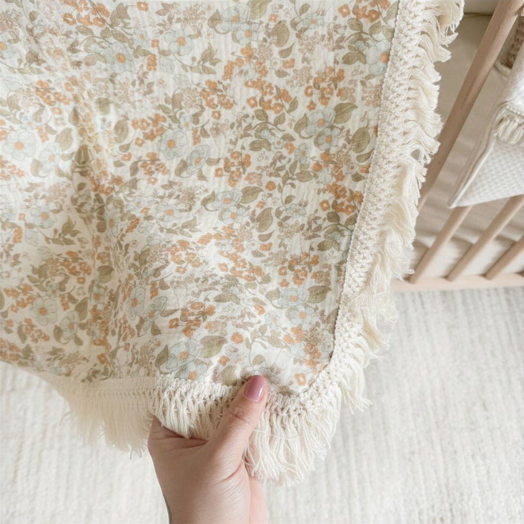 Soft baby blanket with muted floral pattern