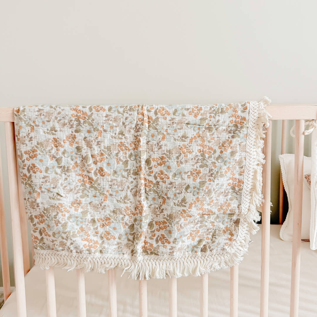 Soft cotton baby blanket with delicate floral pattern