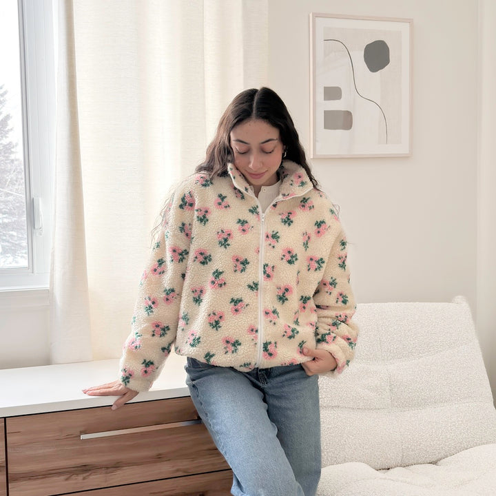 Soft sherpa jacket with full zipper and floral accents