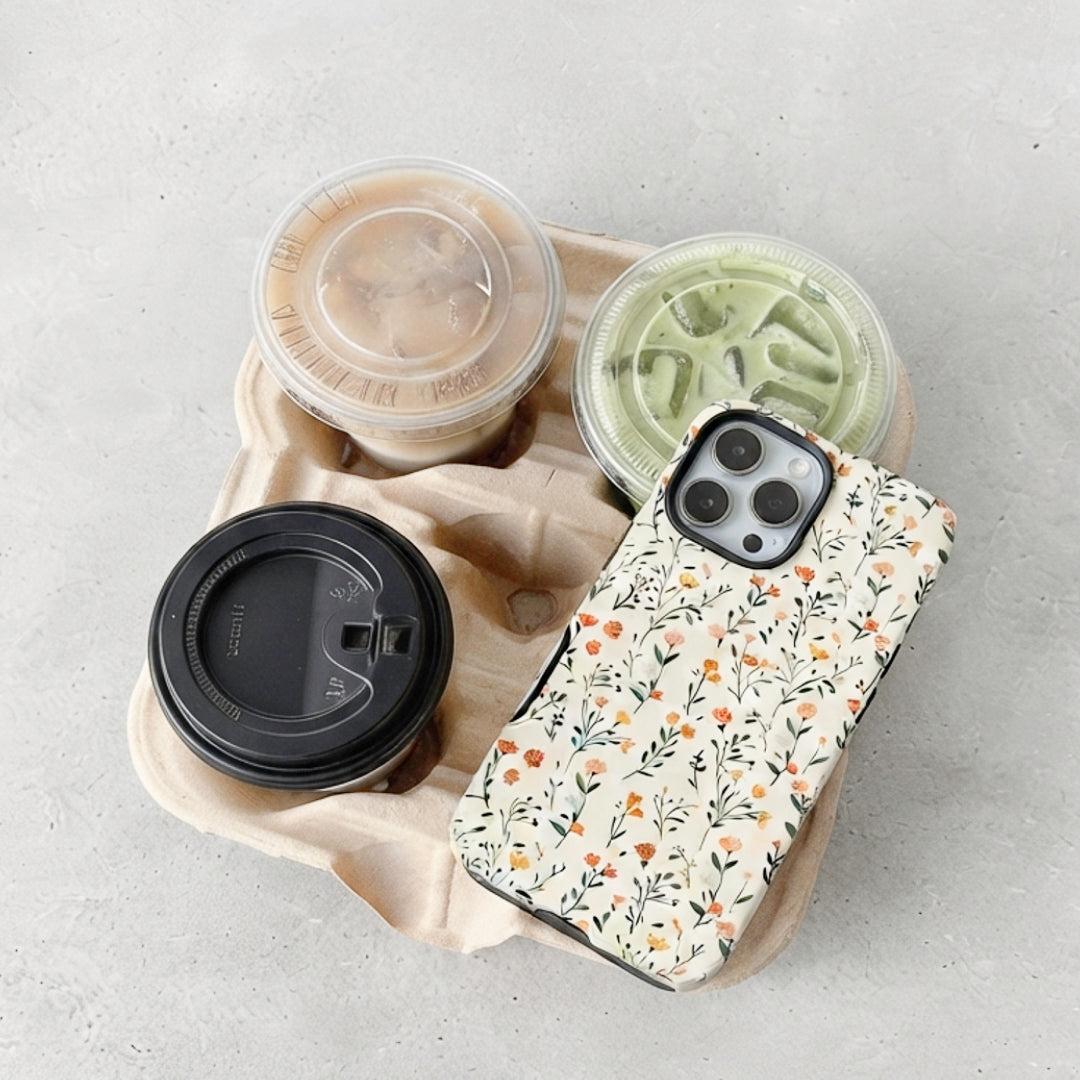 Floral phone case with peach and yellow blossoms