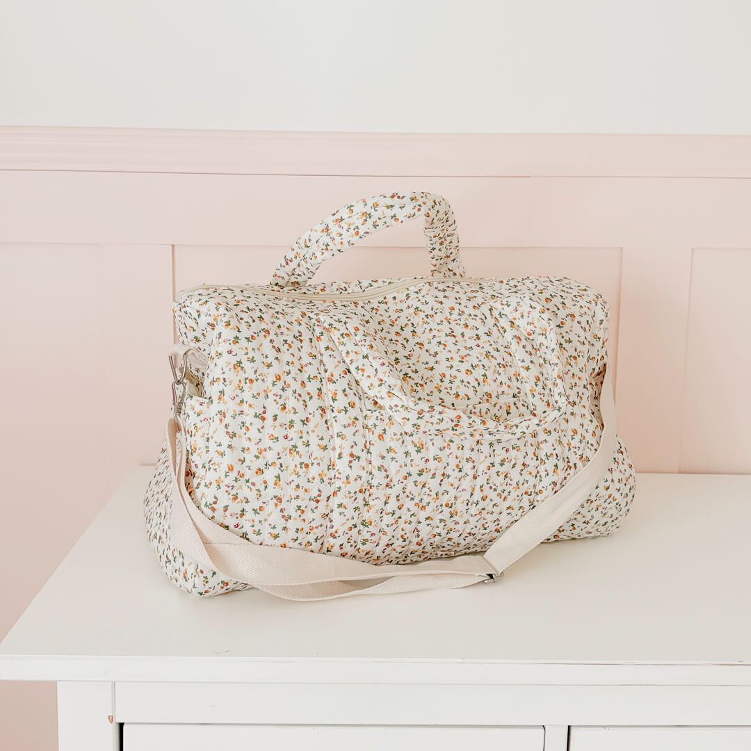 Quilted floral travel bag with top handles