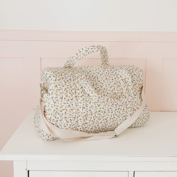 Quilted floral travel bag with top handles