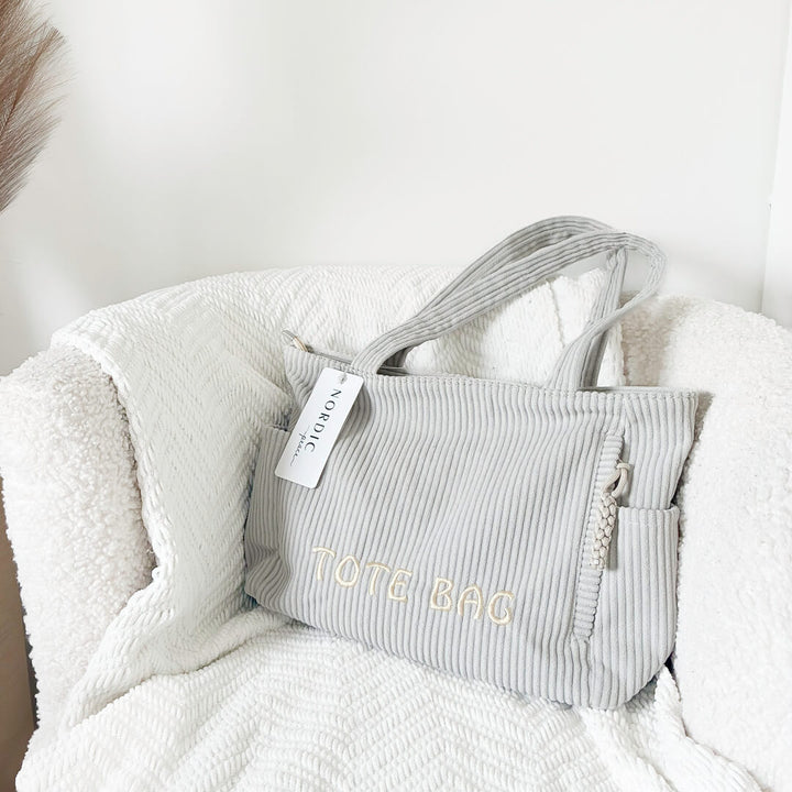 Casual tote bag with shoulder straps and zip pocket