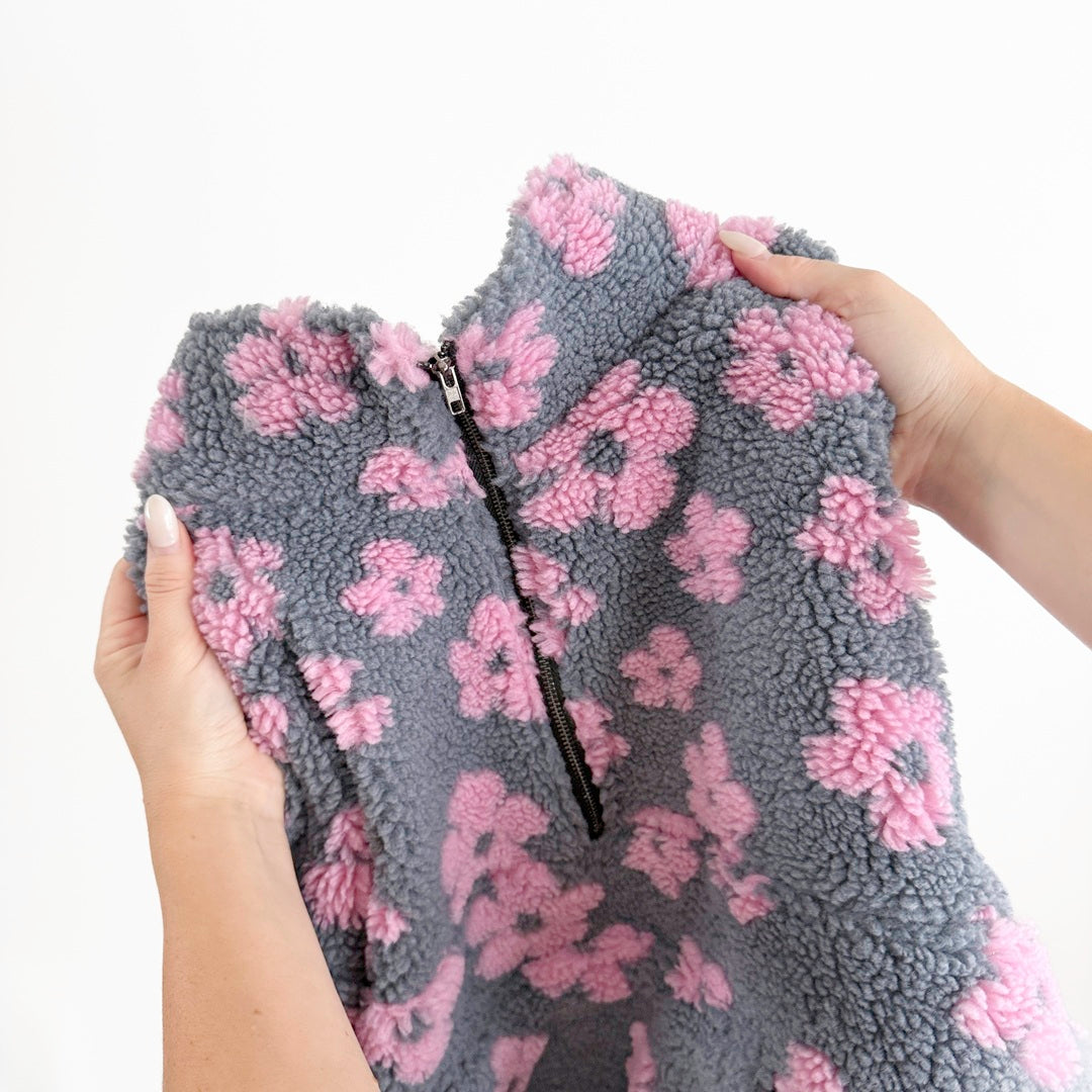 Soft fleece sweater with pink floral design and roomy sleeves
