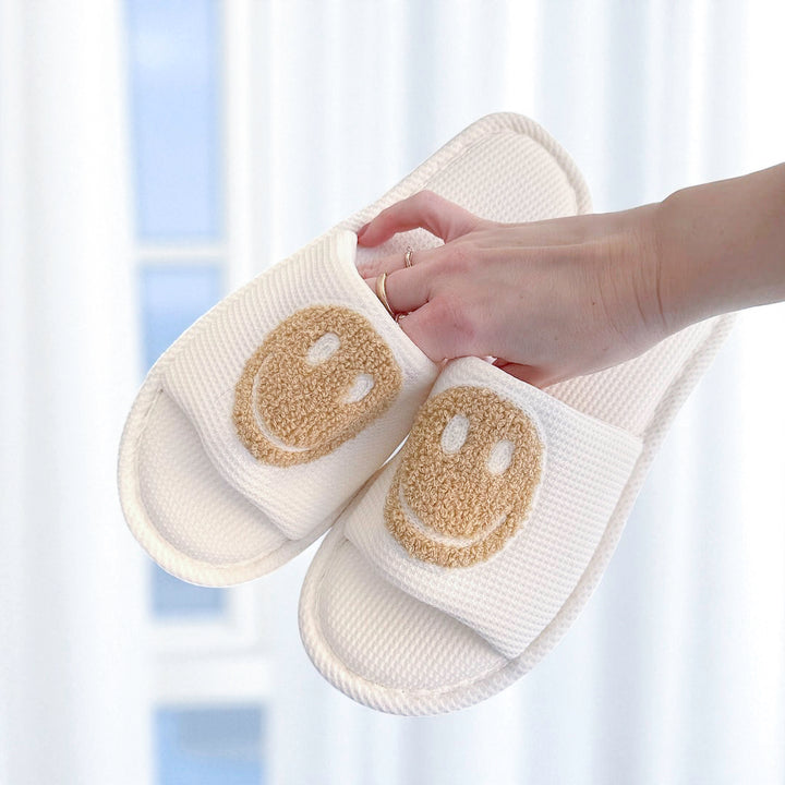 beige happy face slippers