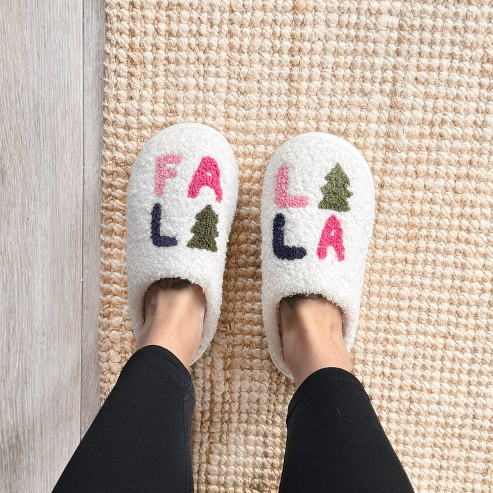 Soft house slippers with Fa La La text and green tree accents