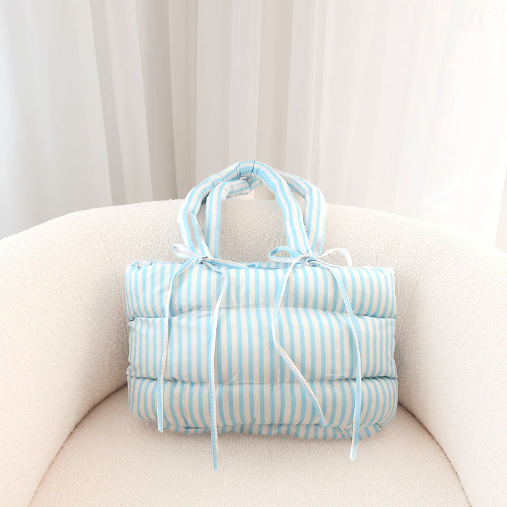 blue Quilted puffer bag with bow tie accents