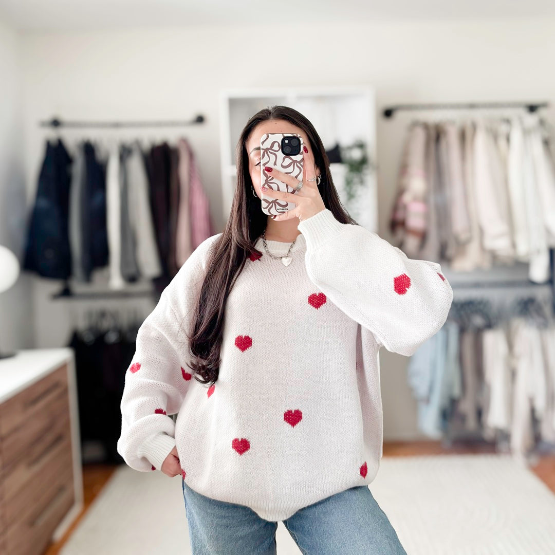 Women’s pullover sweater with red heart pattern and soft knit fabric