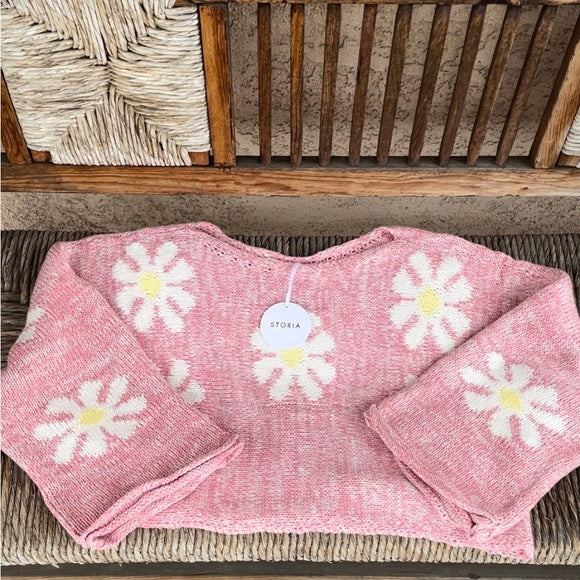 Pink daisy sweater on display