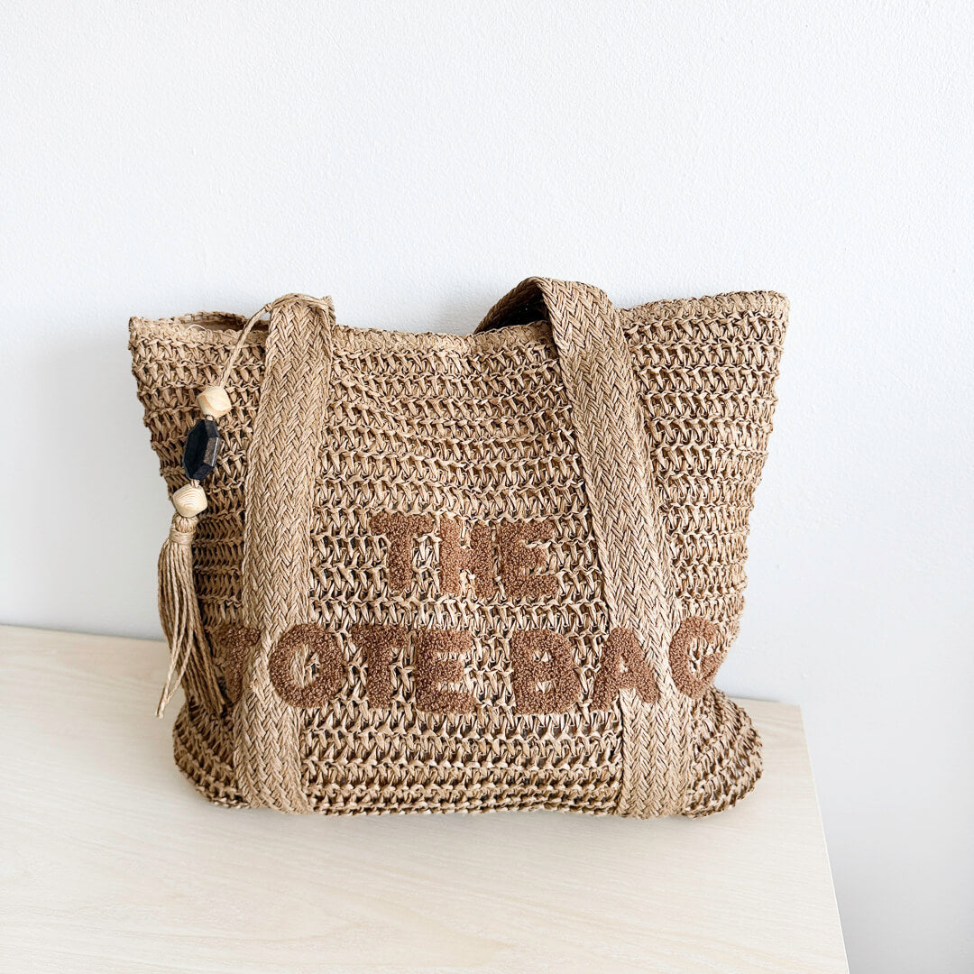 Natural straw tote bag with wide shoulder handles