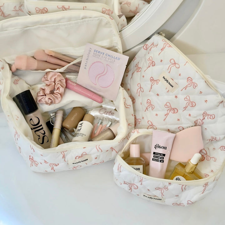 Makeup bags with bows and beauty products