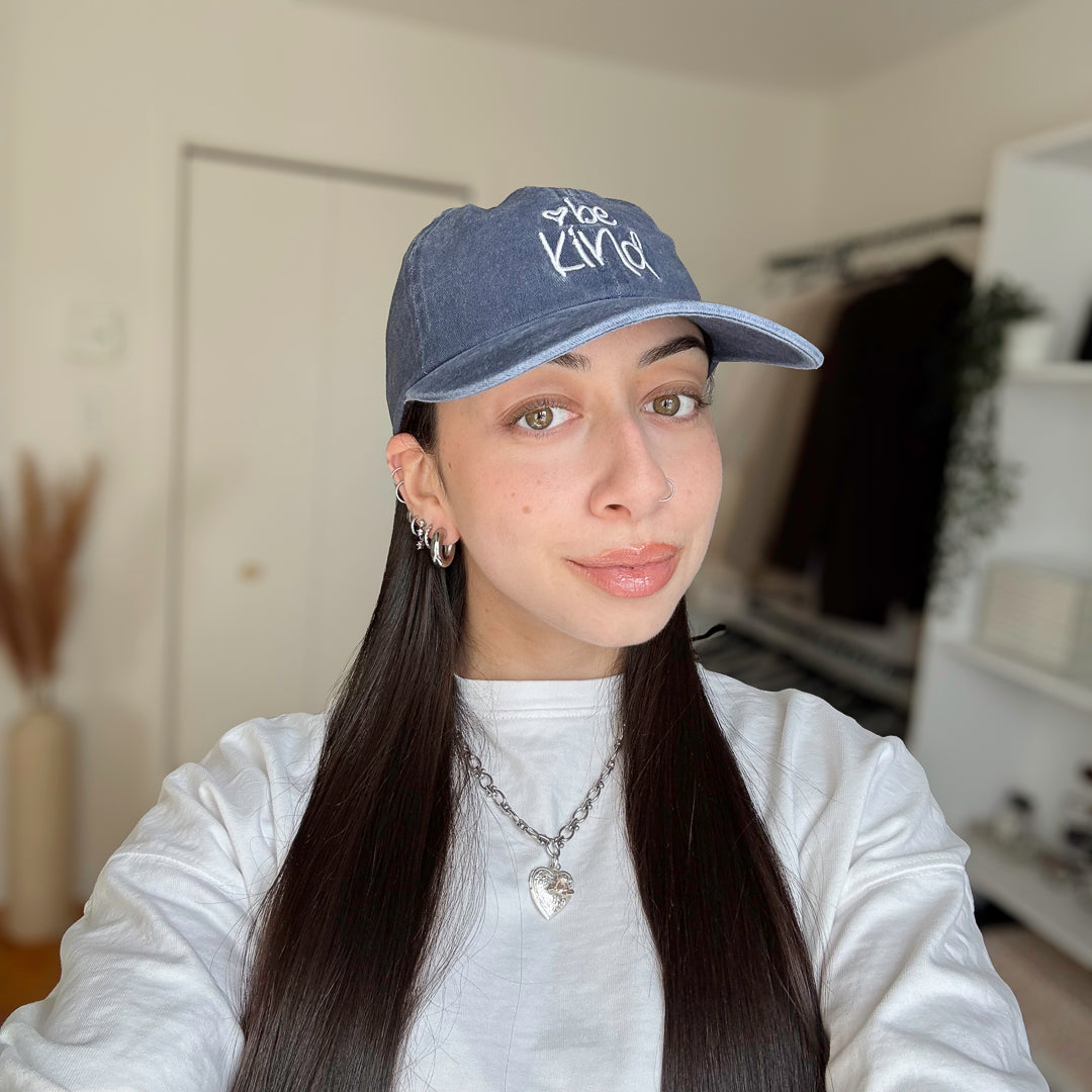 baseball cap with embroidered text and vintage style finish