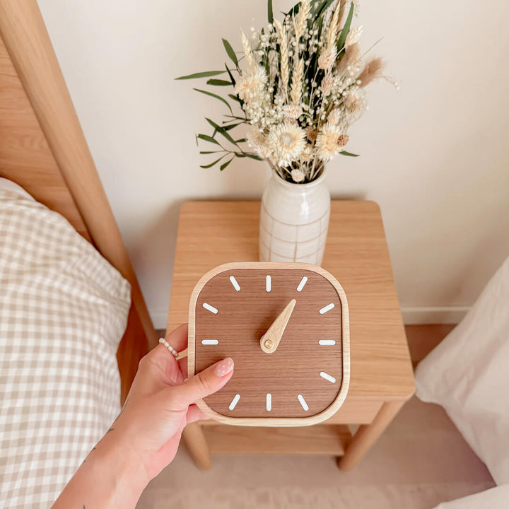 Natural wood bedside clock with simple analog face