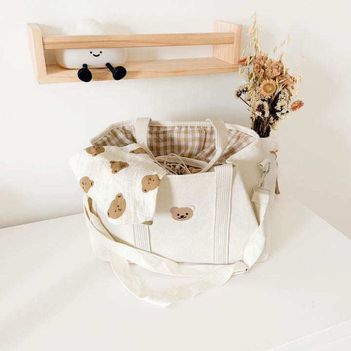 Travel diaper bag with spacious interior and strap