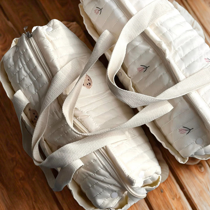 Stroller-compatible diaper tote for baby essentials