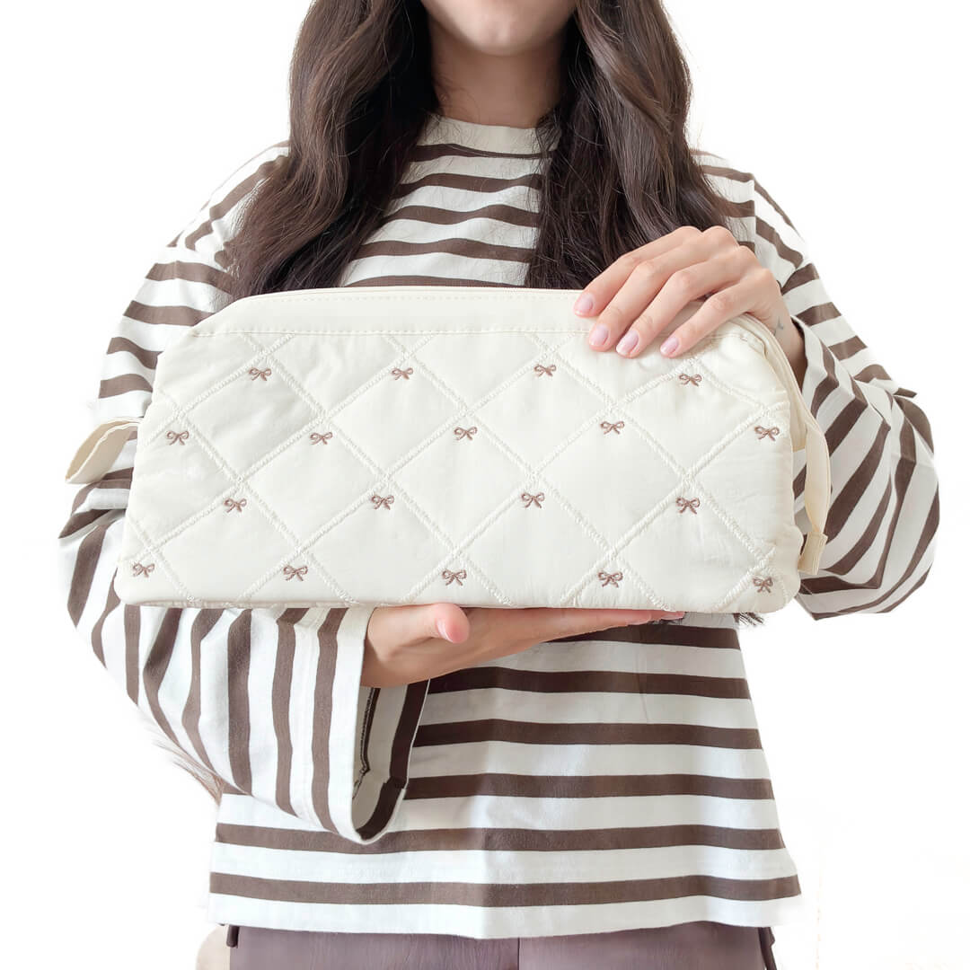 offwhite quilted makeup bag with bow pattern