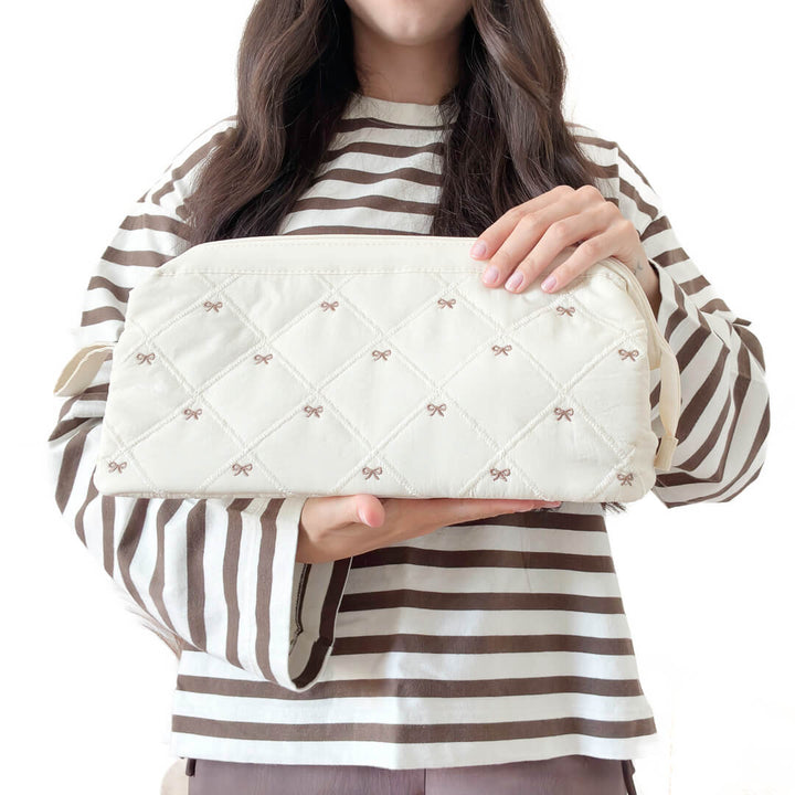 offwhite quilted makeup bag with bow pattern