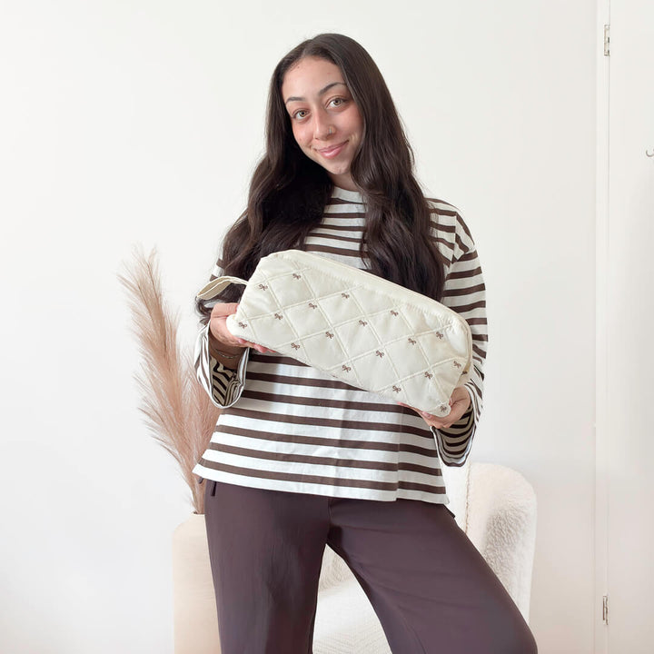 Soft quilted toiletry pouch with bow details